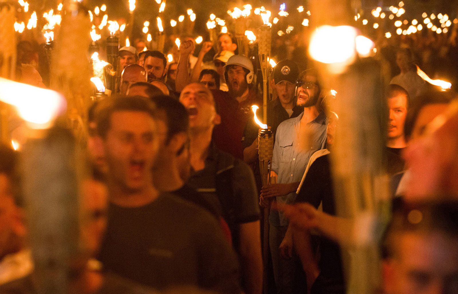 Neo-Nazis, members of the alt-right and white supremacists march through the University of Virginia in Charlottesville